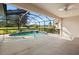 Enclosed pool with spa and golf course view at 5625 Whispering Oaks Dr, North Port, FL 34287