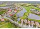 Aerial view of Heron Creek Golf & Country Club community, showcasing homes, golf course, and lakes at 5752 Whispering Oaks Dr., North Port, FL 34287