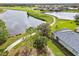 Aerial view of home, pond, and golf course at 5752 Whispering Oaks Dr., North Port, FL 34287