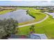 Aerial view of home with golf course and pond at 5752 Whispering Oaks Dr., North Port, FL 34287