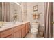 Bathroom with double sinks and a toilet at 5752 Whispering Oaks Dr., North Port, FL 34287