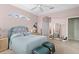 Spacious bedroom with a floral headboard and ample natural light at 5752 Whispering Oaks Dr., North Port, FL 34287