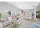 Combined living and dining room with light walls and a neutral color scheme at 5752 Whispering Oaks Dr., North Port, FL 34287