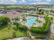 Resort-style pool with clubhouse and lounge chairs at 5752 Whispering Oaks Dr., North Port, FL 34287