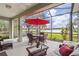 Spacious screened patio overlooking a lake and golf course at 5752 Whispering Oaks Dr., North Port, FL 34287