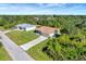 Aerial view of two-house property with driveway and yard at 6174 Alloway St, Englewood, FL 34224