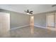 Bedroom with tile floors, ceiling fan, and walk-in closet at 6174 Alloway St, Englewood, FL 34224