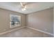 Bright bedroom with tile floors and window at 6174 Alloway St, Englewood, FL 34224