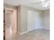 Bedroom with tile floors and access to hallway and other rooms at 6174 Alloway St, Englewood, FL 34224