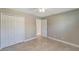 Bedroom with double doors and tile floors at 6174 Alloway St, Englewood, FL 34224