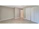 Bedroom with double doors and tile floors at 6174 Alloway St, Englewood, FL 34224