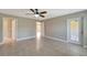 Large bedroom with tile floors and access to bathroom and another bedroom at 6174 Alloway St, Englewood, FL 34224