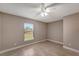 Bright bedroom with tile floors and ceiling fan at 6174 Alloway St, Englewood, FL 34224