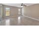 Spacious bedroom with tile flooring and ceiling fan at 6174 Alloway St, Englewood, FL 34224