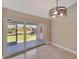 Bright dining area with sliding glass doors leading to a patio at 6174 Alloway St, Englewood, FL 34224