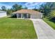 Single-story house with driveway and lawn at 6174 Alloway St, Englewood, FL 34224