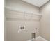 Laundry room with shelving and hookups at 6174 Alloway St, Englewood, FL 34224