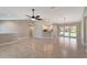 Open floor plan living area with tile floors and high ceilings at 6174 Alloway St, Englewood, FL 34224