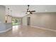 Open concept living area with tile flooring and access to the backyard at 6174 Alloway St, Englewood, FL 34224