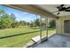 Relaxing screened porch overlooking a grassy backyard at 6174 Alloway St, Englewood, FL 34224