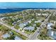 Aerial showing home's location in a lush, tropical neighborhood near the water at 668 W Olympia Ave, Punta Gorda, FL 33950