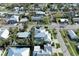 Aerial view of house with pool and neighborhood at 668 W Olympia Ave, Punta Gorda, FL 33950