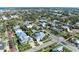 Wide shot of the home and neighborhood from a bird's eye view at 668 W Olympia Ave, Punta Gorda, FL 33950