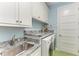 Laundry room with granite countertop and stainless steel sink at 668 W Olympia Ave, Punta Gorda, FL 33950