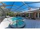 Pool and spa with covered patio and outdoor kitchen at 668 W Olympia Ave, Punta Gorda, FL 33950