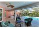 Covered patio with seating and a view of the pool at 668 W Olympia Ave, Punta Gorda, FL 33950