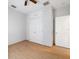 Light bedroom with double door closet and wood-look tile floor at 81 Michigan Ave, Englewood, FL 34223