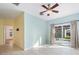 Bright living room with tile floors and sliding glass doors leading to backyard at 81 Michigan Ave, Englewood, FL 34223