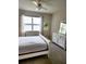 Bright bedroom with lake view and white bedroom set at 8773 Tuscany Isles Dr, Punta Gorda, FL 33950