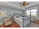 Bedroom with water views and ceiling fan at 900 E Marion Ave # 1301, Punta Gorda, FL 33950