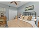 Bedroom with ceiling fan and wooden floors at 900 E Marion Ave # 1301, Punta Gorda, FL 33950