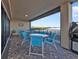 Private patio with table and chairs, overlooking water at 900 E Marion Ave # 1301, Punta Gorda, FL 33950