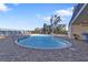 Relaxing kidney-shaped pool with surrounding patio at 900 E Marion Ave # 1301, Punta Gorda, FL 33950