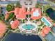 Aerial view showcasing community pool, tennis courts, and building complex at 98 Vivante Blvd # 98317, Punta Gorda, FL 33950