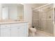 Bathroom with shower, toilet and white vanity at 98 Vivante Blvd # 98317, Punta Gorda, FL 33950