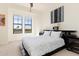 Bedroom with a king-size bed and large windows at 98 Vivante Blvd # 98317, Punta Gorda, FL 33950