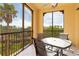 Spacious lanai with glass-top table and chairs at 98 Vivante Blvd # 98317, Punta Gorda, FL 33950