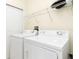 Laundry room with washer, dryer, and overhead shelving at 98 Vivante Blvd # 98317, Punta Gorda, FL 33950