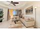 Living room with light beige couches and sliding glass doors to balcony at 98 Vivante Blvd # 98317, Punta Gorda, FL 33950