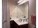 Bathroom with vanity, sink and large mirror at 99 Vivante Blvd # 415, Punta Gorda, FL 33950