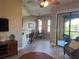 Living room with seating area, and access to balcony at 99 Vivante Blvd # 415, Punta Gorda, FL 33950