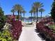 Resort-style pool area with lush landscaping at 99 Vivante Blvd # 415, Punta Gorda, FL 33950