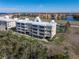 Waterfront building with balconies and tennis court at 101 N Marion Ct # 114, Punta Gorda, FL 33950