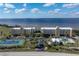 Aerial view of waterfront community with tennis court and pool at 101 N Marion Ct # 114, Punta Gorda, FL 33950