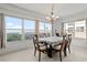 Bright dining room with water views and seating for six at 101 N Marion Ct # 114, Punta Gorda, FL 33950