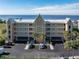 Three-story waterfront building with parking and water views at 101 N Marion Ct # 114, Punta Gorda, FL 33950